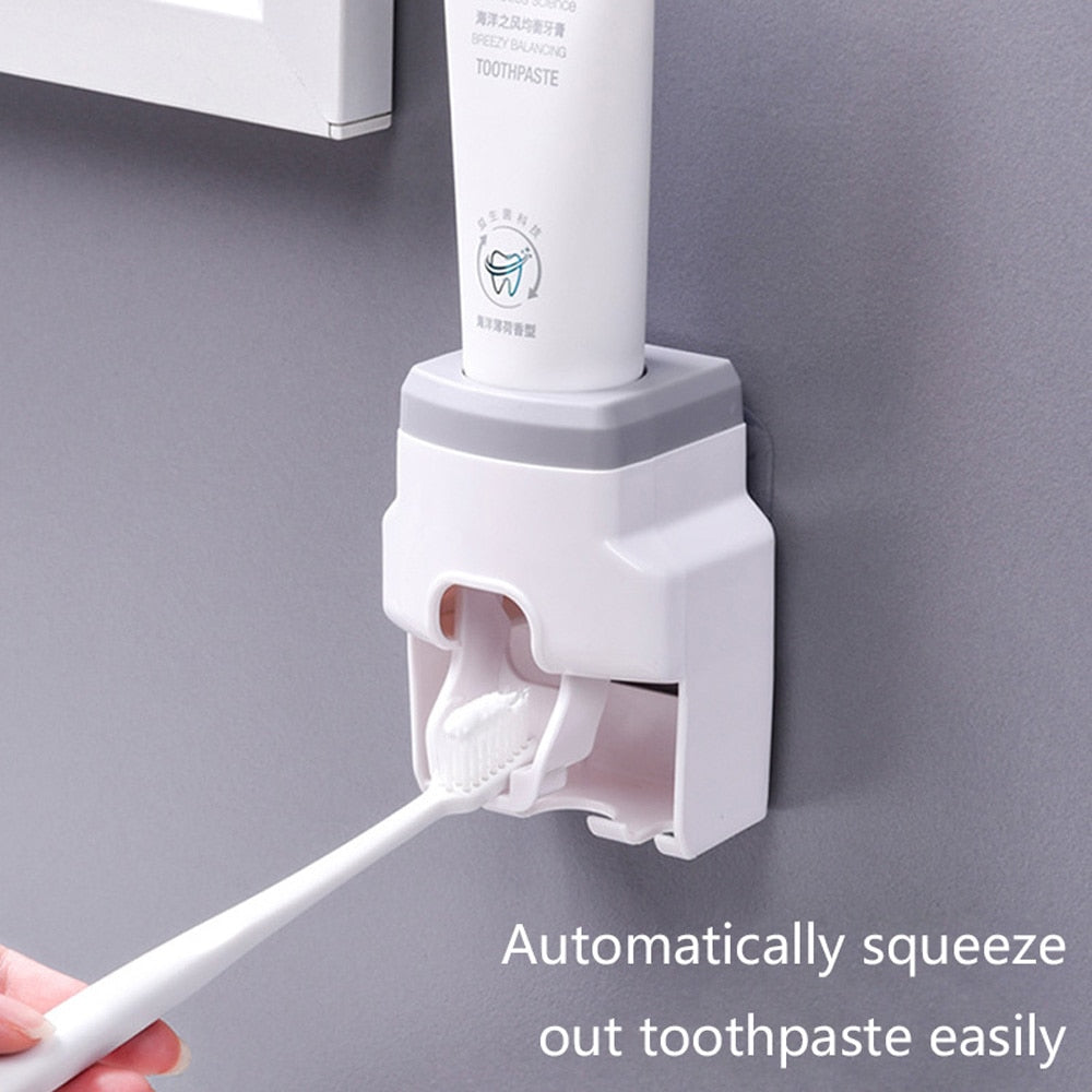 Toothbrush holder with automatic toothpaste dispenser